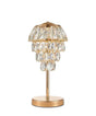 This table lamp features a gold base with a slender stem, topped by cascading crystal pendants arranged in tiers. 