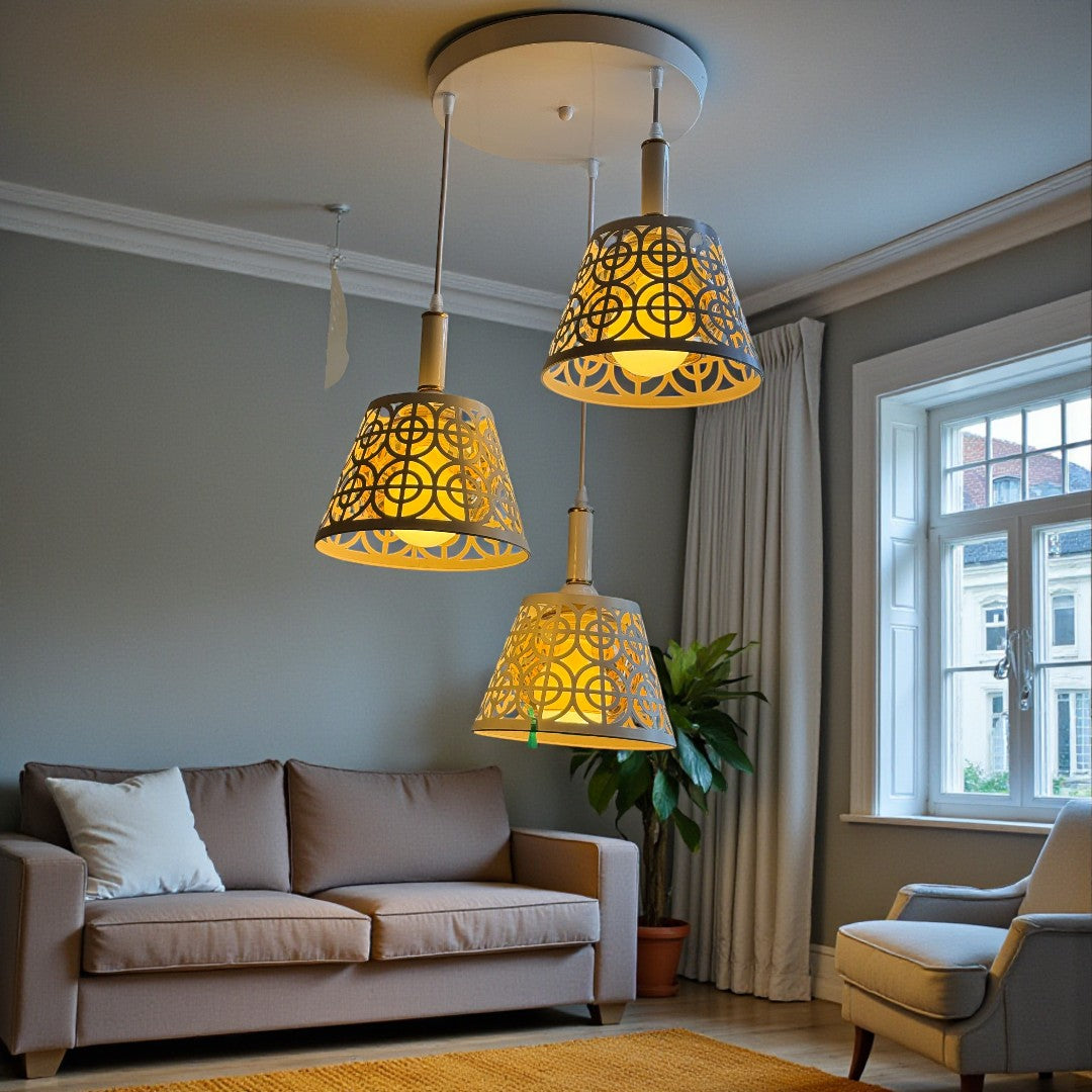 Modern living room with decorative pendant lights, sofa, and armchair.