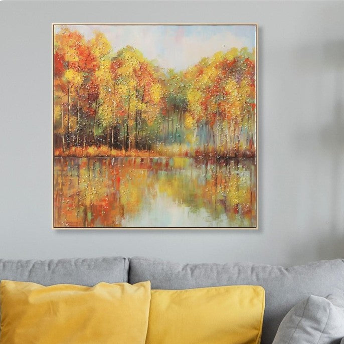 Living room with gray sofa, yellow pillows, and a wall painting of autumn landscape.
