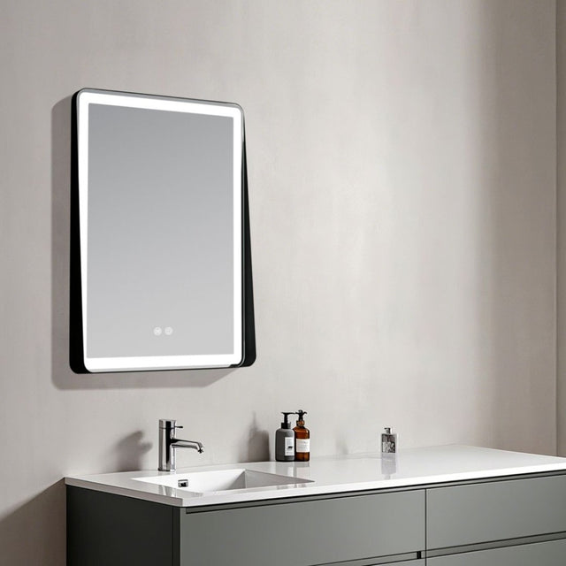 Bathroom vanity with a mirror and sink, featuring modern design elements.