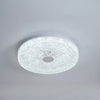 Ceiling light fixture with textured surface on a gray background