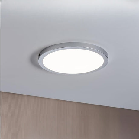 Ceiling-mounted round light fixture on a plain ceiling