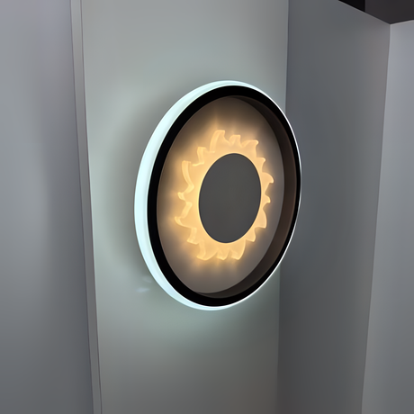 Modern circular LED wall light with heart-shaped design, fixed on a white wall.