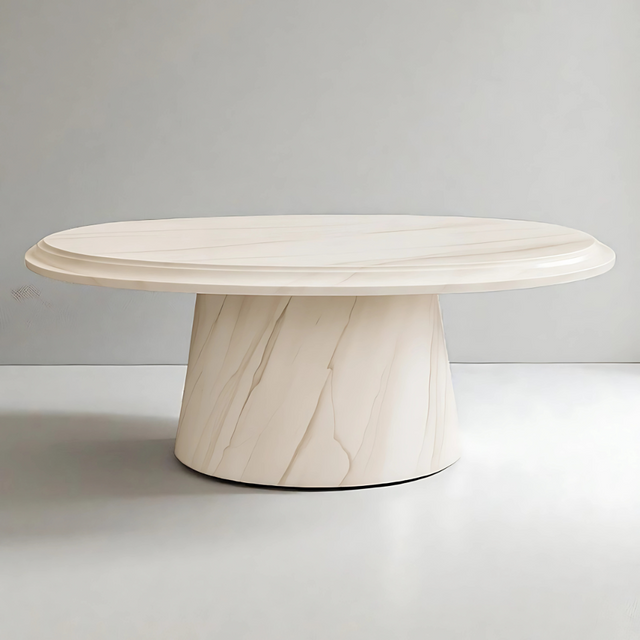 Marble coffee table with a light beige color on a plain background