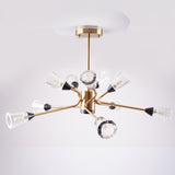 Modern chandelier with gold finish and multiple angled arms holding clear fluted glass shades.