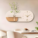 Modern wall clock with wooden design on a light-colored wall.