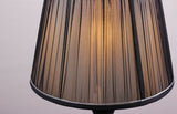  black pleated lampshade adorned with silver trim, equipped with an E27 LED light, emits a warm and sophisticated glow.