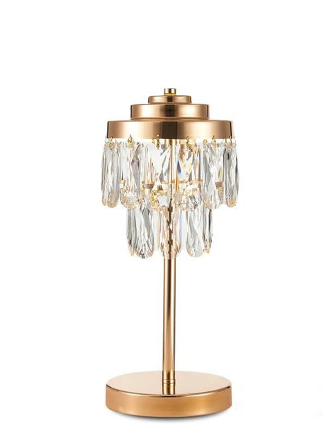 This table lamp features a gold base with a slender stem, topped by cascading crystal pendants arranged in tiers. 