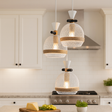 Modern kitchen with pendant lights and a countertop setup
