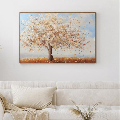 Living room with a white sofa, wooden coffee table, and a painting of a tree on the wall.