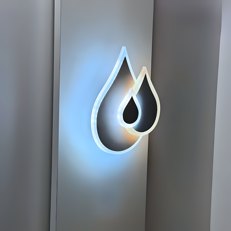 Wall-mounted LED light fixture shaped like two overlapping water droplets, with a soft white and warm white glow illuminating the surrounding wall.