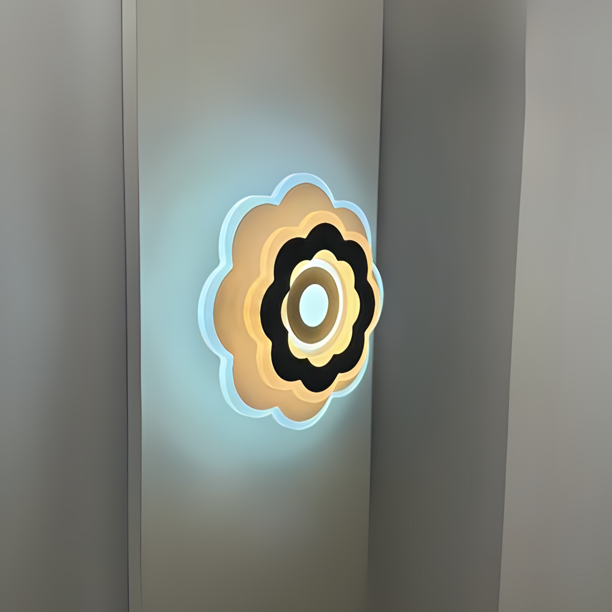 Modern Flower LED Wall Light in a sleek flower shape, crafted from metal and acrylic, fixed on a white wall, emitting soft, warm white light.