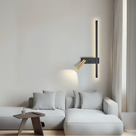 A modern bedside wall lamp with a sleek black base, a vertical LED bar for ambient lighting, and an adjustable gold spotlight for focused illumination.