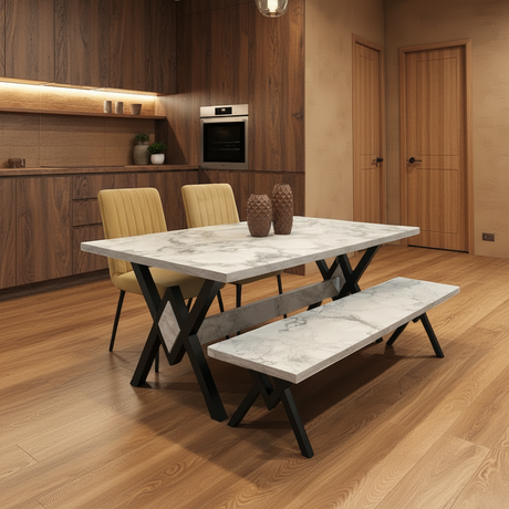 Dining table with marble-like top and black X-shaped legs in a modern kitchen setting.