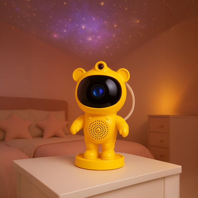 Yellow astronaut-like night light on a bedside table with a starry sky projection in the background.