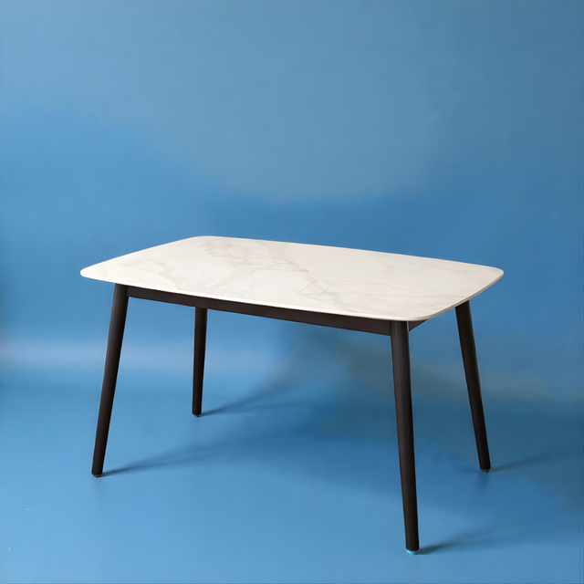 Rectangular table with marble-like top and dark legs on a blue background