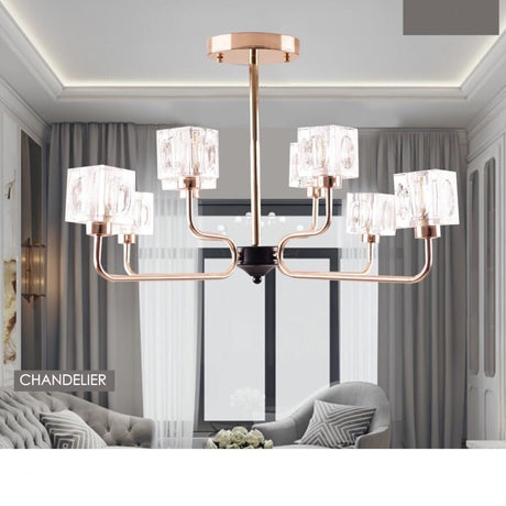 A modern chandelier with a rose gold metal frame and multiple cubic glass light covers in a living room setting.
