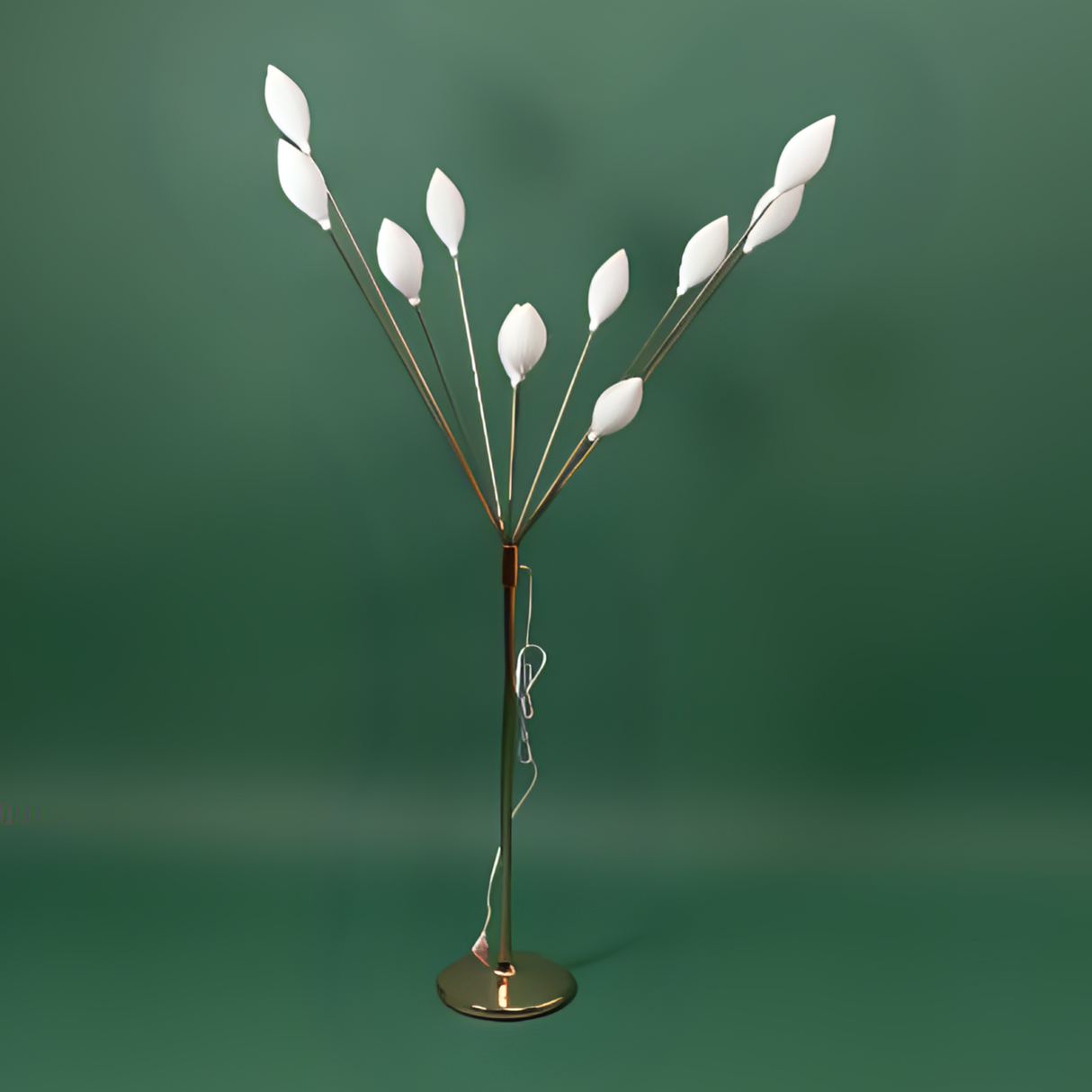 A floor lamp with a metal stand and multiple petal-like white plastic bulbs, arranged like a blooming tree.