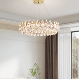 Chandelier hanging in a room with a window and plant