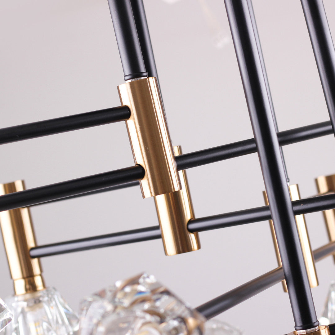 A zoomed-in view of an industrial chandelier with black rods and gold cylindrical connectors.