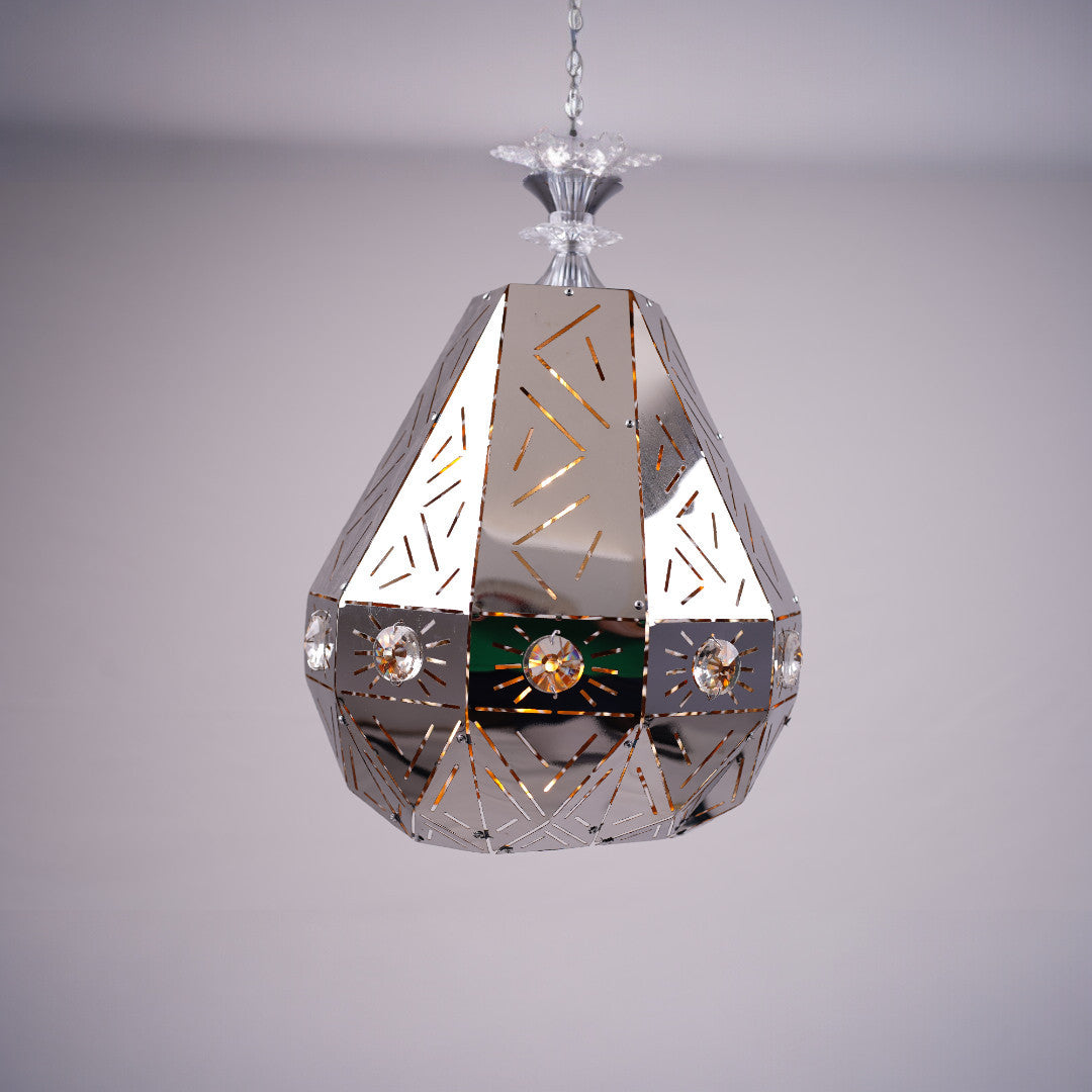 A geometric, faceted metal pendant light with reflective surfaces and decorative patterns, displayed against a soft background.
