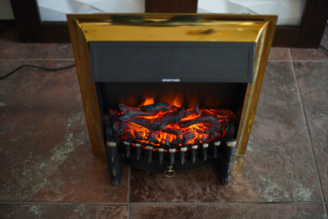  A compact electric fireplace with a black and gold design, glowing red ember effect, and a modern aesthetic.