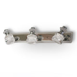 A sleek and contemporary triple-led bulb chrome wall light fixture with clear glass shades, mounted on a metallic base.