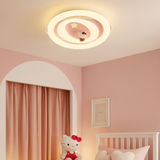Ceiling light fixture in a child's bedroom with pink walls and a Hello Kitty toy.