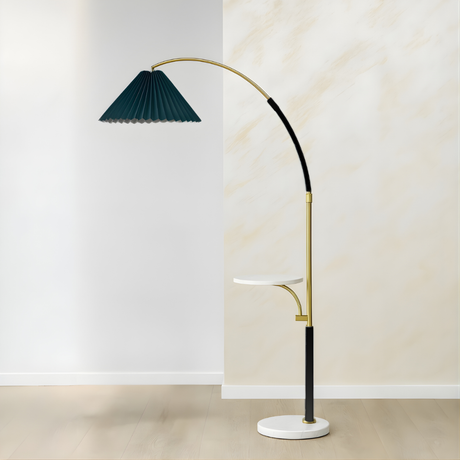 Modern floor lamp with a green pleated shade and gold accents on a neutral background