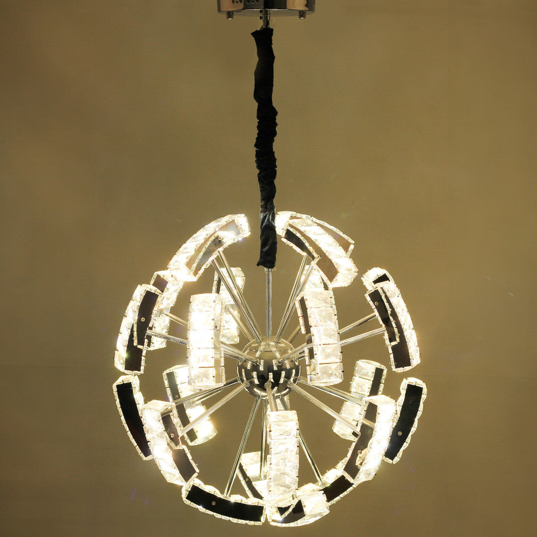 A contemporary circular crystal pendant chandelier with a layered design, featuring clear glass panels and a mirrored frame, suspended against a light background.