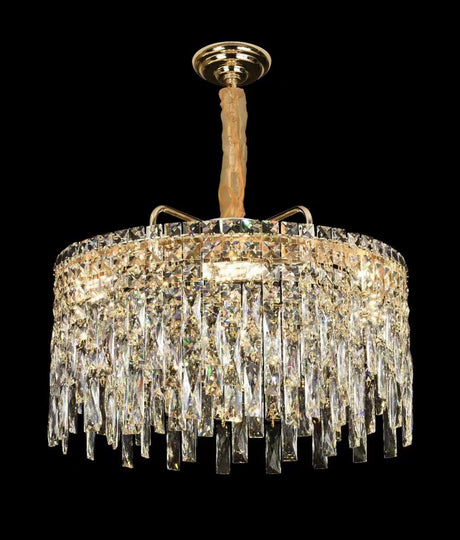  A grand crystal chandelier with cascading glass elements, shining brilliantly against a black background.