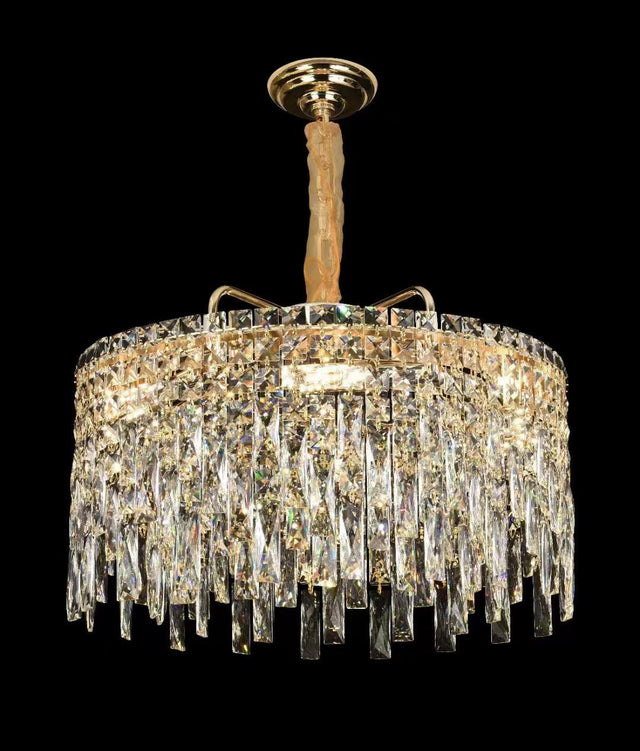  A grand crystal chandelier with cascading glass elements, shining brilliantly against a black background.
