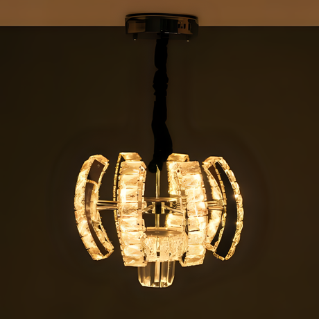 A modern crystal pendant chandelier featuring geometric curved glass segments illuminated with warm white light, suspended from a twisted black cord and chrome ceiling mount.