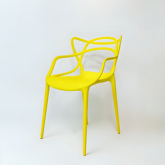A yellow chair with a unique geometric backrest and armrest design, made from plastic, against a white background.