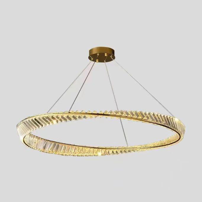 A modern gold and crystal circular chandelier