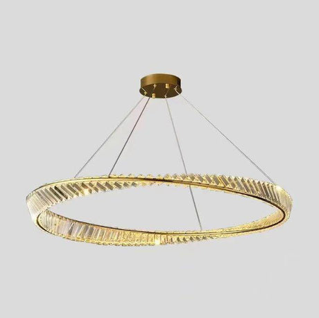 A modern gold and crystal circular chandelier