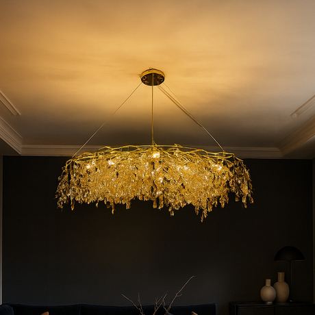 Modern living room with a dark sofa, coffee table, and decorative chandelier.