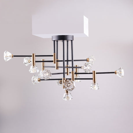 A stylish, modern chandelier with an angular black metal frame, gold details, and multiple glowing bulbs.