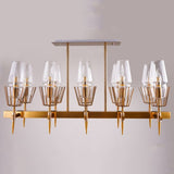 A sleek gold chandelier with a geometric design and multiple glass-shaded lights, mounted on a light-colored ceiling.