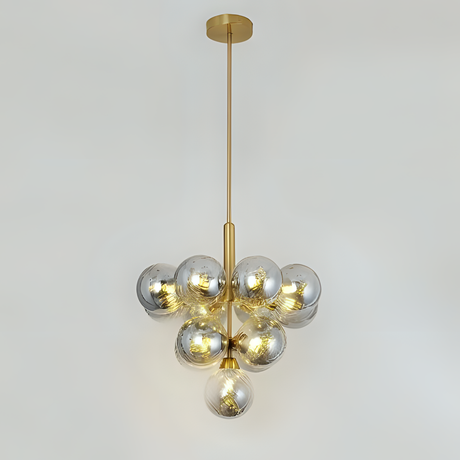 A cluster pendant light featuring grey-tinted glass globes arranged in a geometric shape, emitting a warm glow.