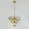 A cluster pendant light featuring grey-tinted glass globes arranged in a geometric shape, emitting a warm glow.