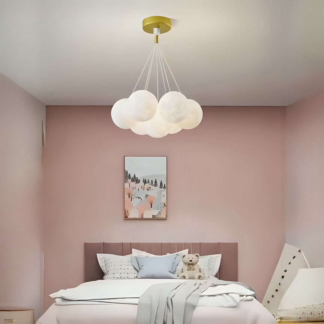 A cloud-inspired pendant light fixture with multiple frosted white globes, creating a soft and airy look.
