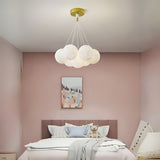 A cloud-inspired pendant light fixture with multiple frosted white globes, creating a soft and airy look.
