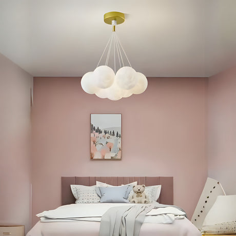 A cloud-inspired pendant light fixture with multiple frosted white globes, creating a soft and airy look.
