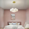 A cloud-inspired pendant light fixture with multiple frosted white globes, creating a soft and airy look.
