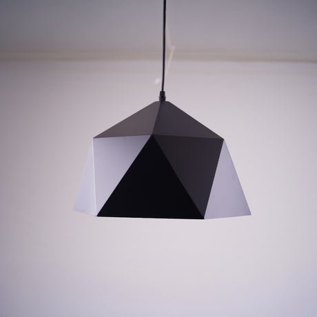 A geometric black pendant light with a faceted.