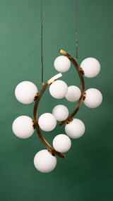 A close-up of the white globe chandelier, emphasizing its artistic and elegant form.
