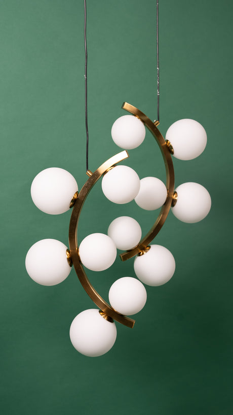 A close-up of the white globe chandelier, emphasizing its artistic and elegant form.
