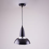 A black and silver pendant light with a conical shape, suspended from a white ceiling.
