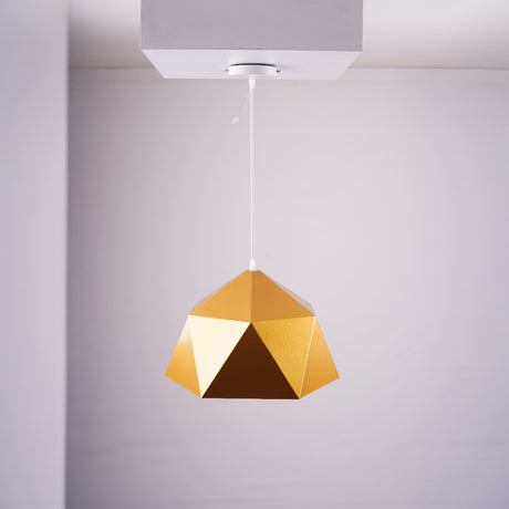 A bold, gold geometric pendant light with a faceted dome design, hanging from a white ceiling.
